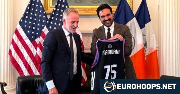 New York City Mayor Zohran Mamdani poses with a Paris Basketball jersey